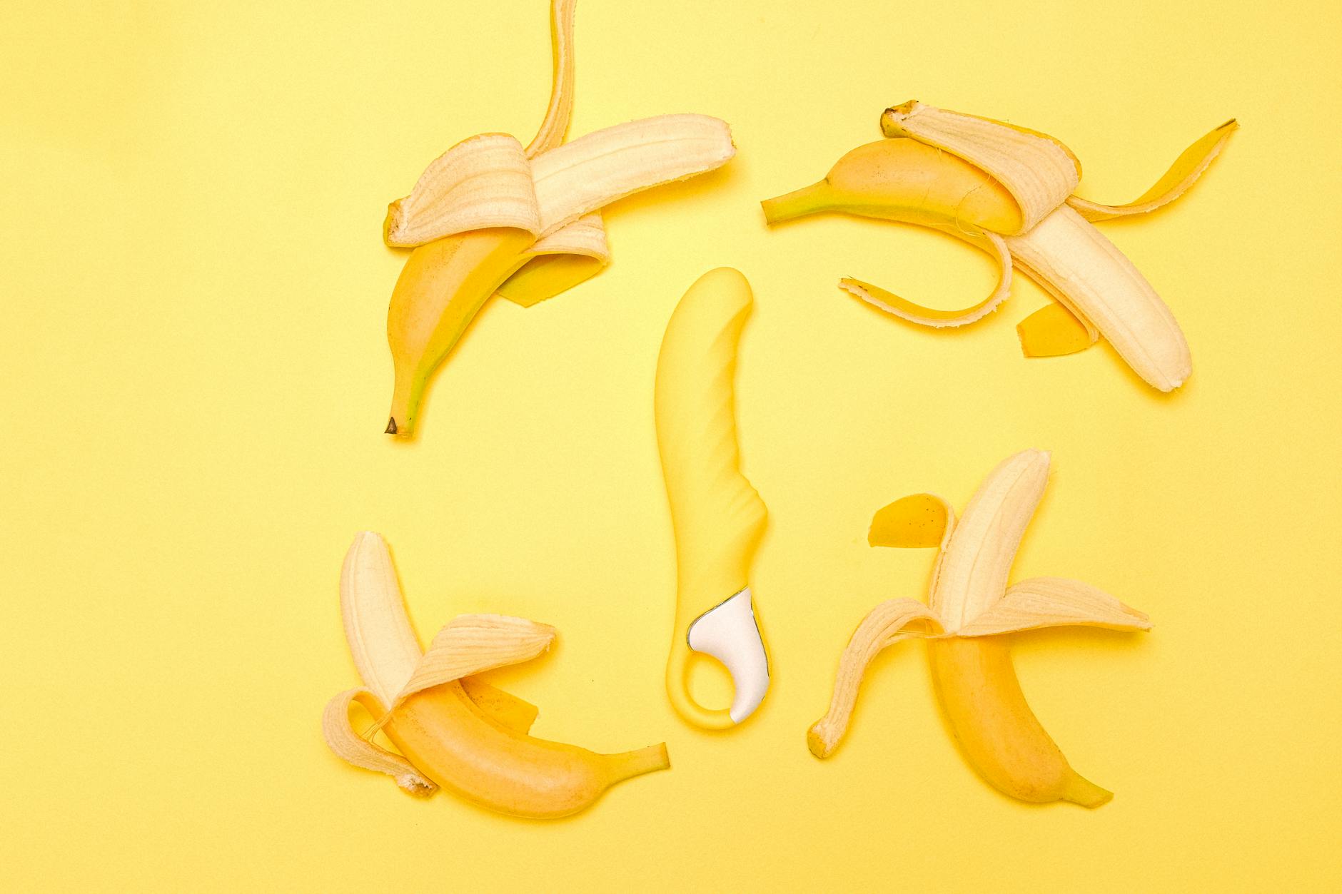 A bright yellow lemon vibrator arranged on a minimalist surface, symbolizing reliable clitoral stimulation