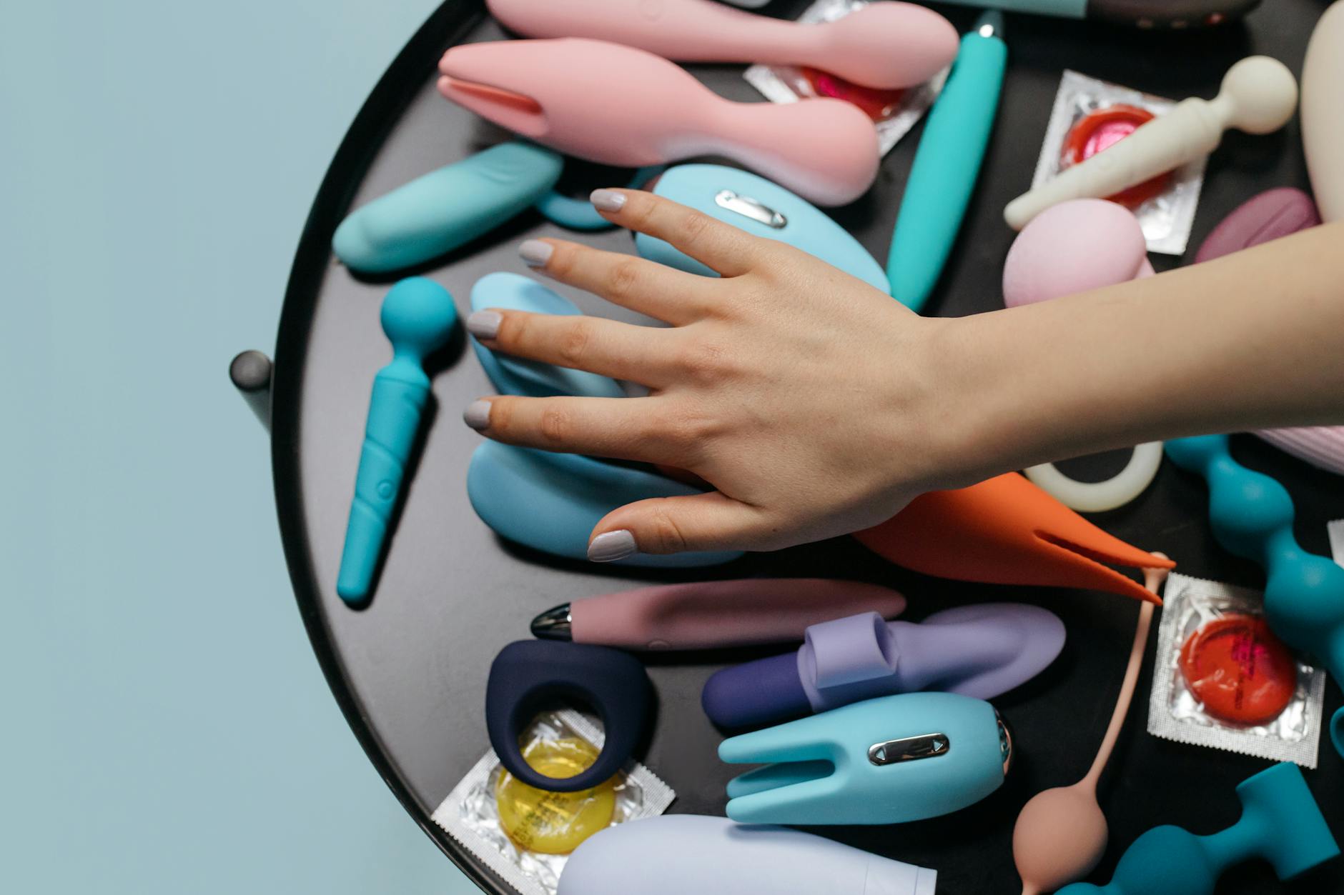 Woman holding lemon vibrators, illustrating self-pleasure without pressure